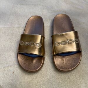 Bebe Metallic Gold Slides.